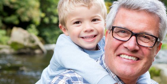 man with glasses and boy