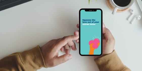 person holding mobile phone saying 'squeeze the love out of your extras cover'