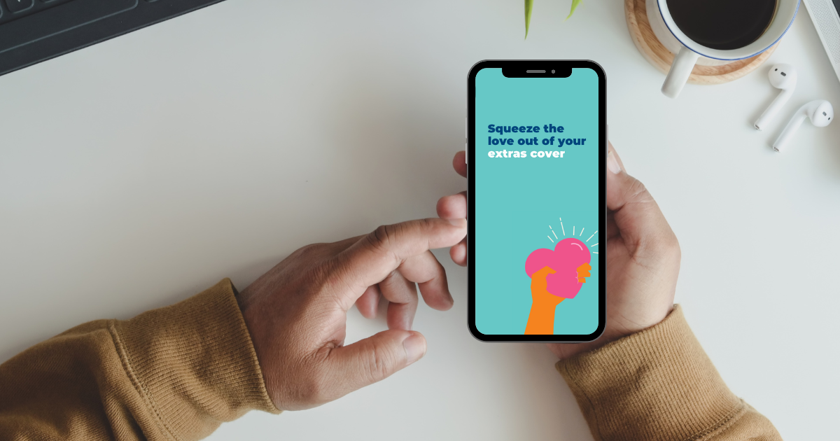 person holding mobile phone saying 'squeeze the love out of your extras cover'