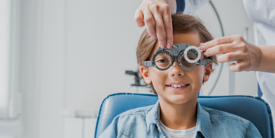 little boy getting his eyes tested for myopia